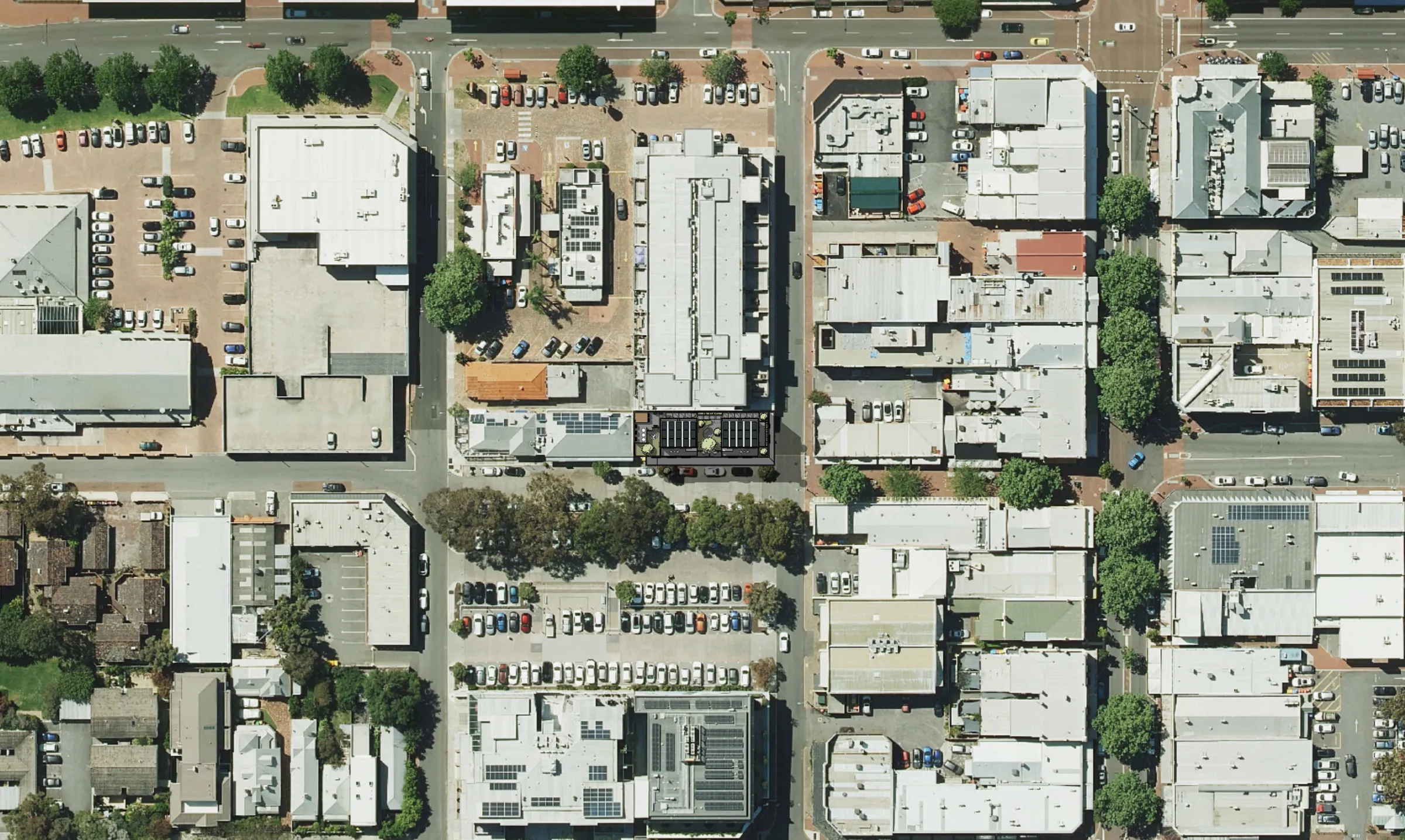 Aerial photograph of central Subiaco with the building's roof plan shown on its corner site