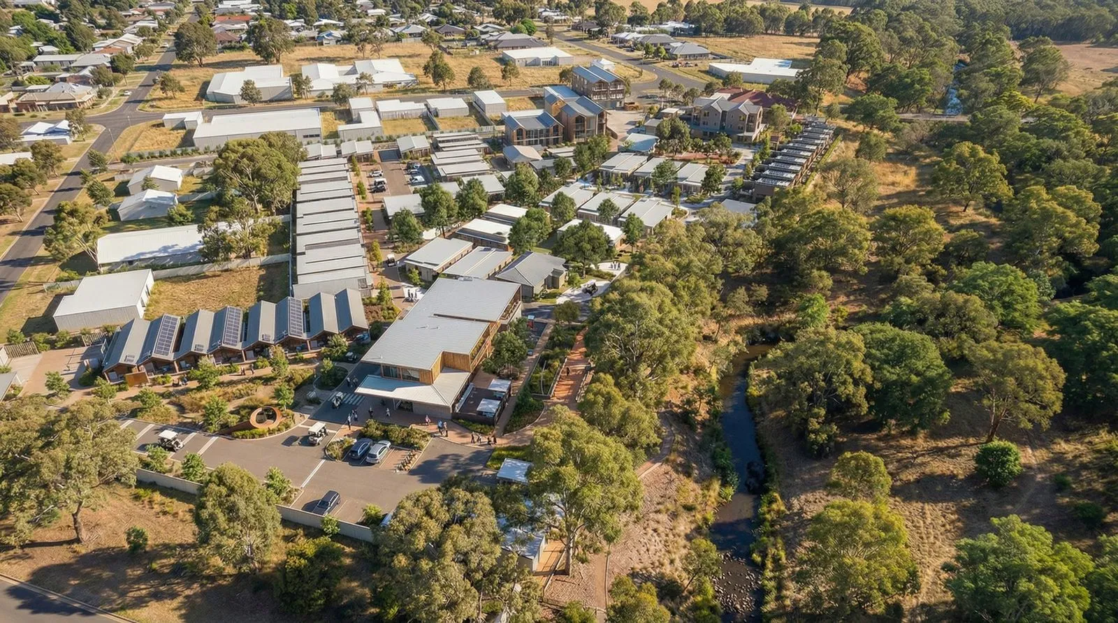 Aerial oblique view of the village and clubhouse among the trees